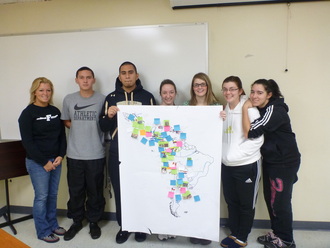 Students with map of Latin America